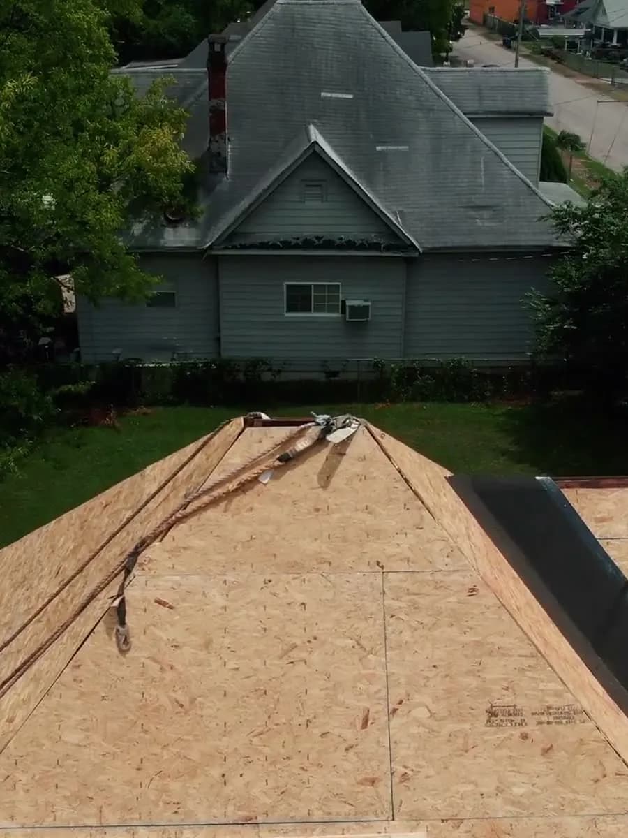 Full roof replacement underway on a two-story home