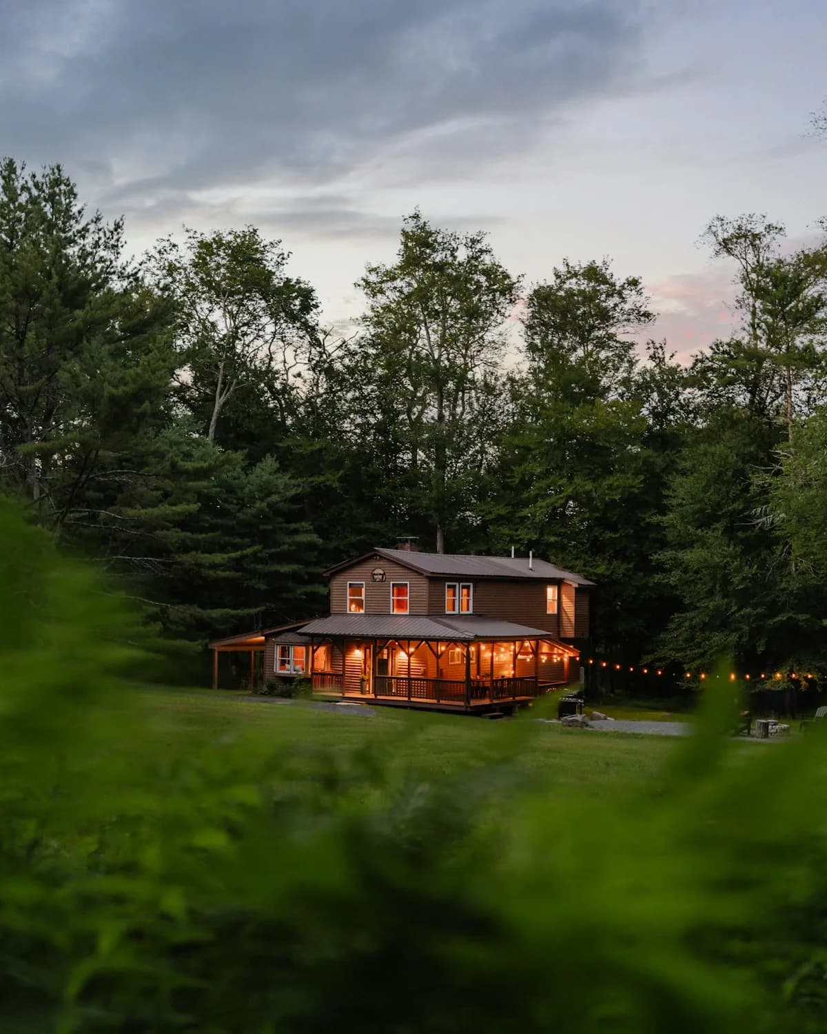 Family home lit up in the evening under a new roof
