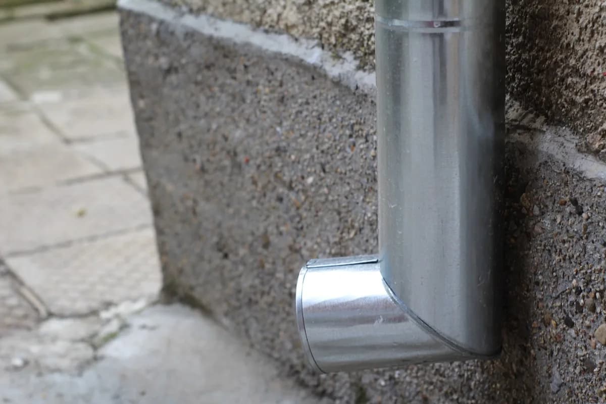 Downspout routing water away from a foundation