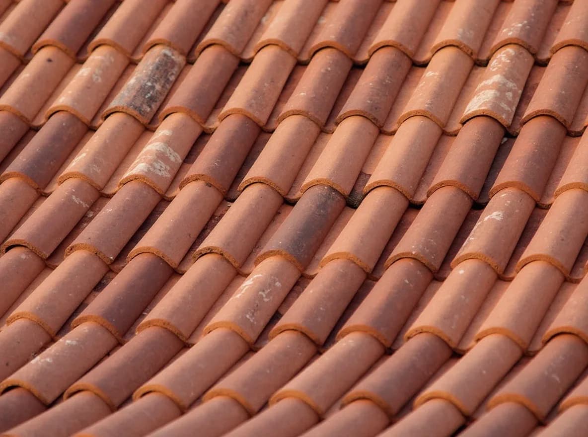 Restored terracotta tile roof with rebuilt dormer