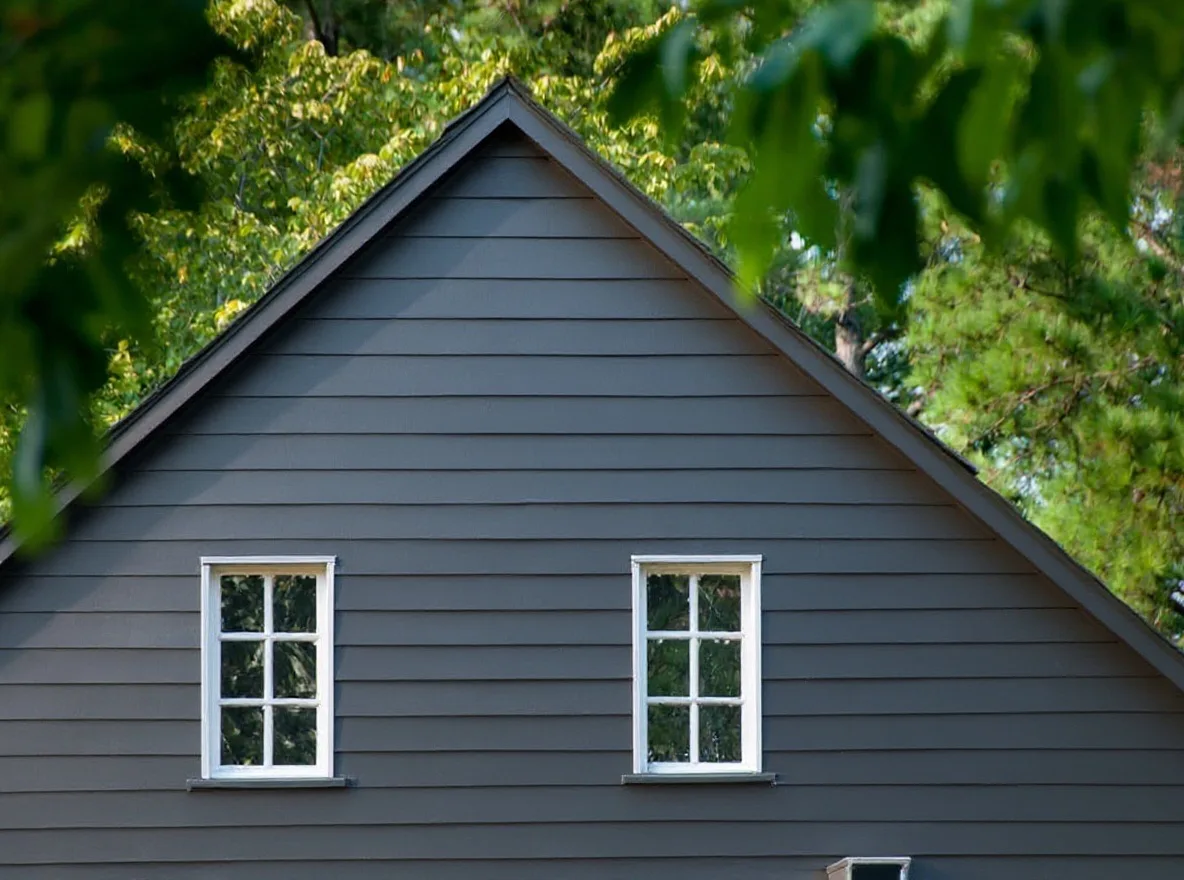 Modern dark-gray siding after the full re-side